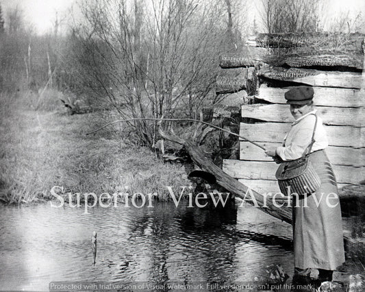 Lady Fishing with a Creel